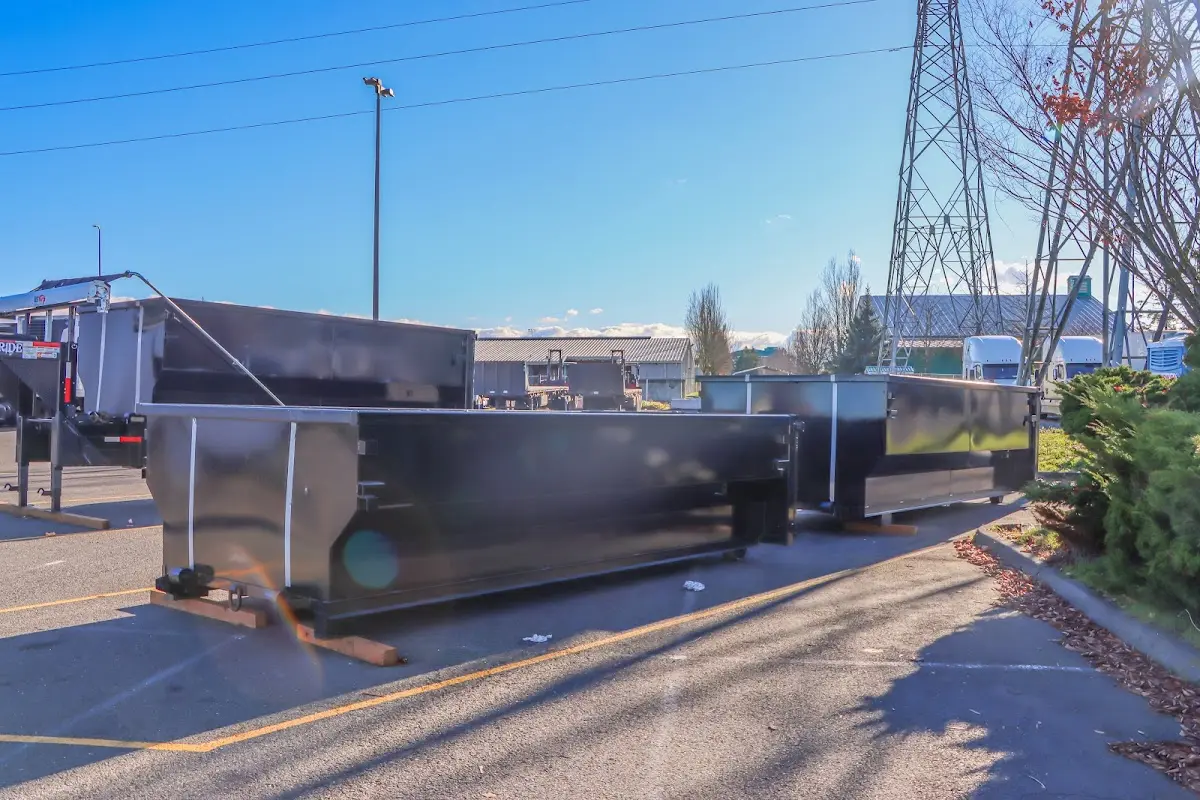 Roll-off dumpster ready for waste disposal at job site for 3 Yard Dumpster Rental in Cambridge